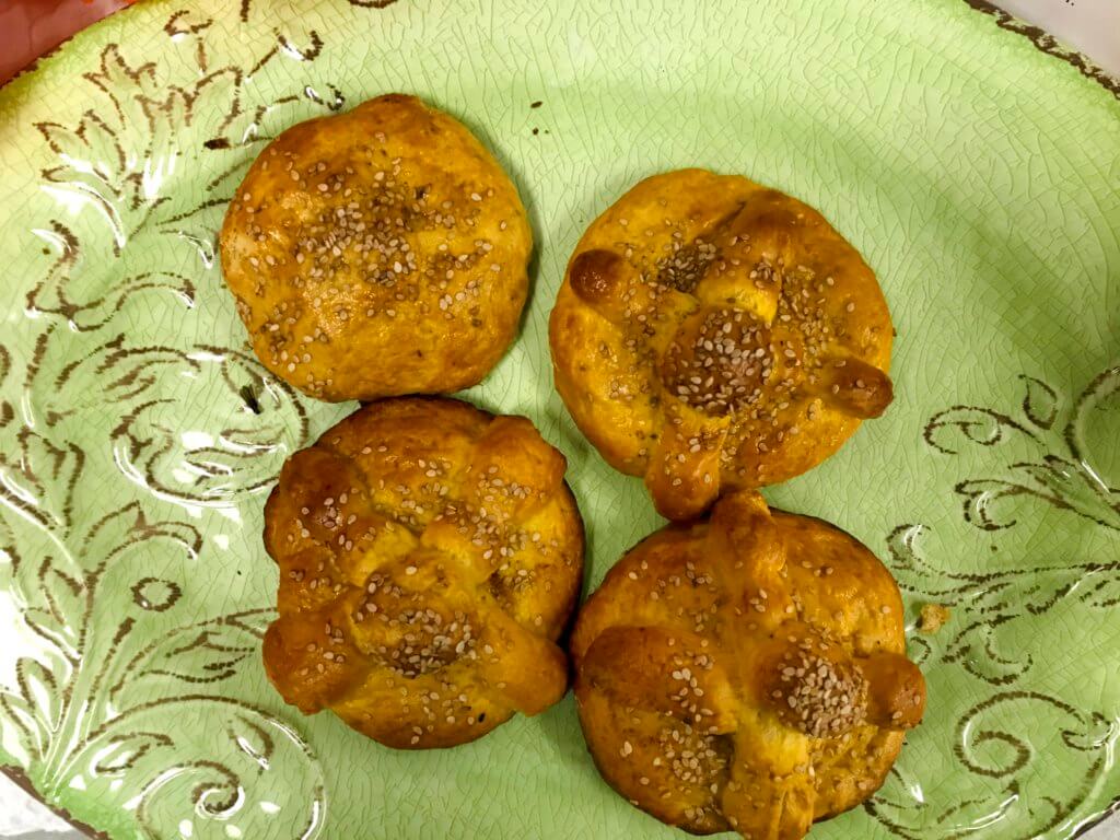 Four pieces of bread of the dead. This bread is usually made on Día De Los Muertos.